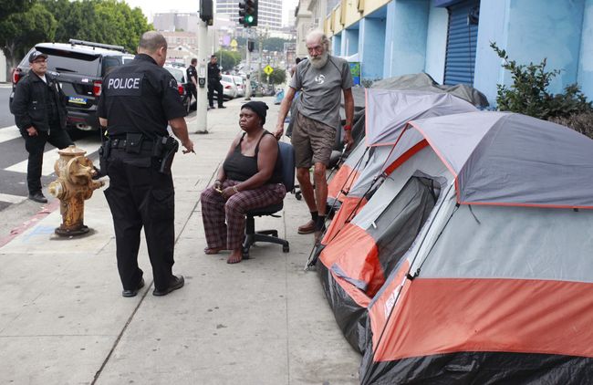 The LAPD is running an outreach unit to monitor the homeless population in the city. A homeless outreach unit in Koreatown is investigating one homeless person. Sang Jim Kim