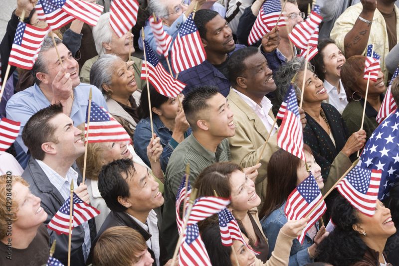 High angle view of happy multi ethnic people holding American flag