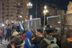 Buenos Aires protest clashes intensify as demonstrators push over barricades outside Congress.